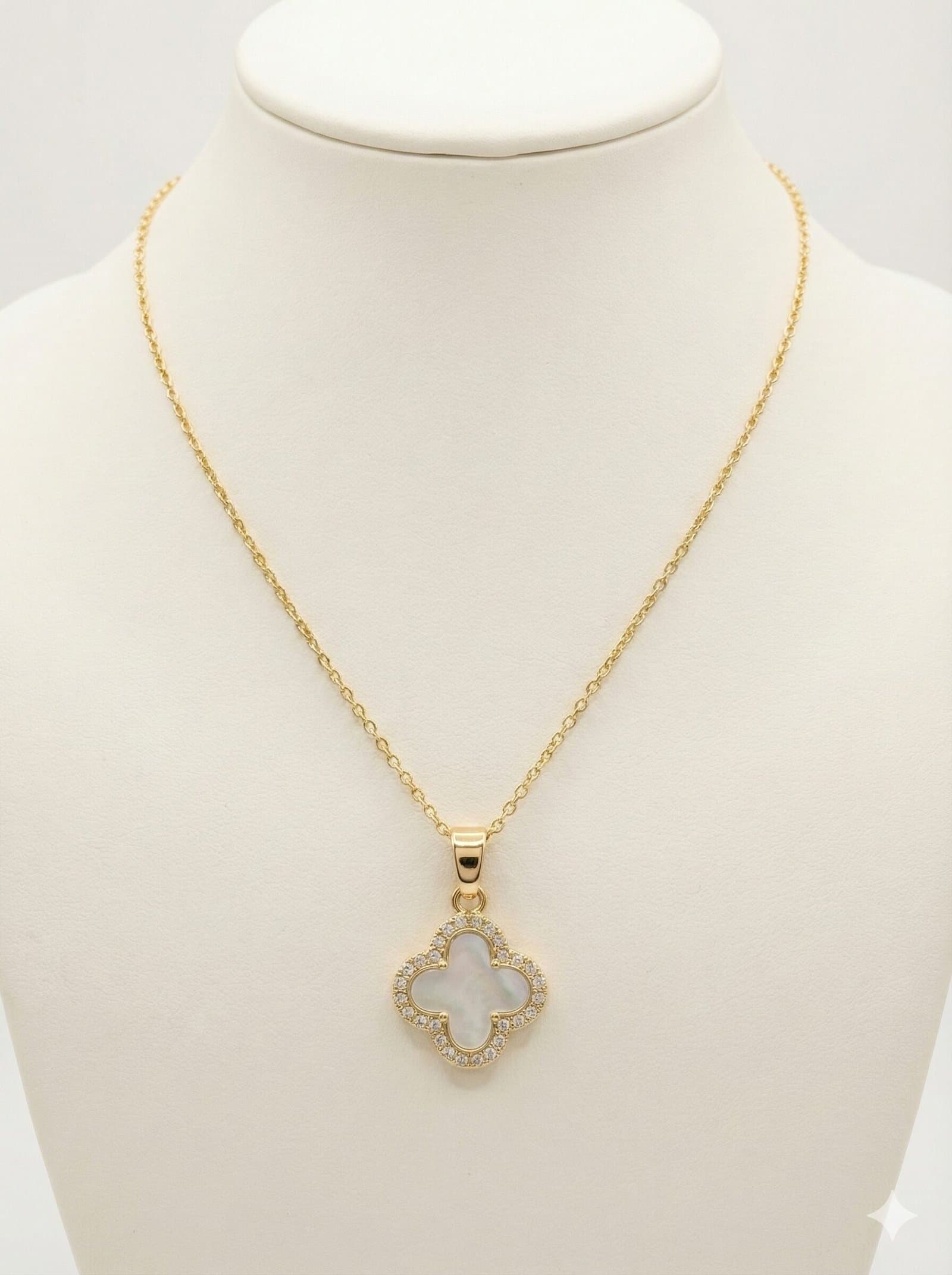 Gold-Tone Four-Leaf Clover Pendant Necklace with White Pearlescent Inlay and Crystal Halo Border — image 1