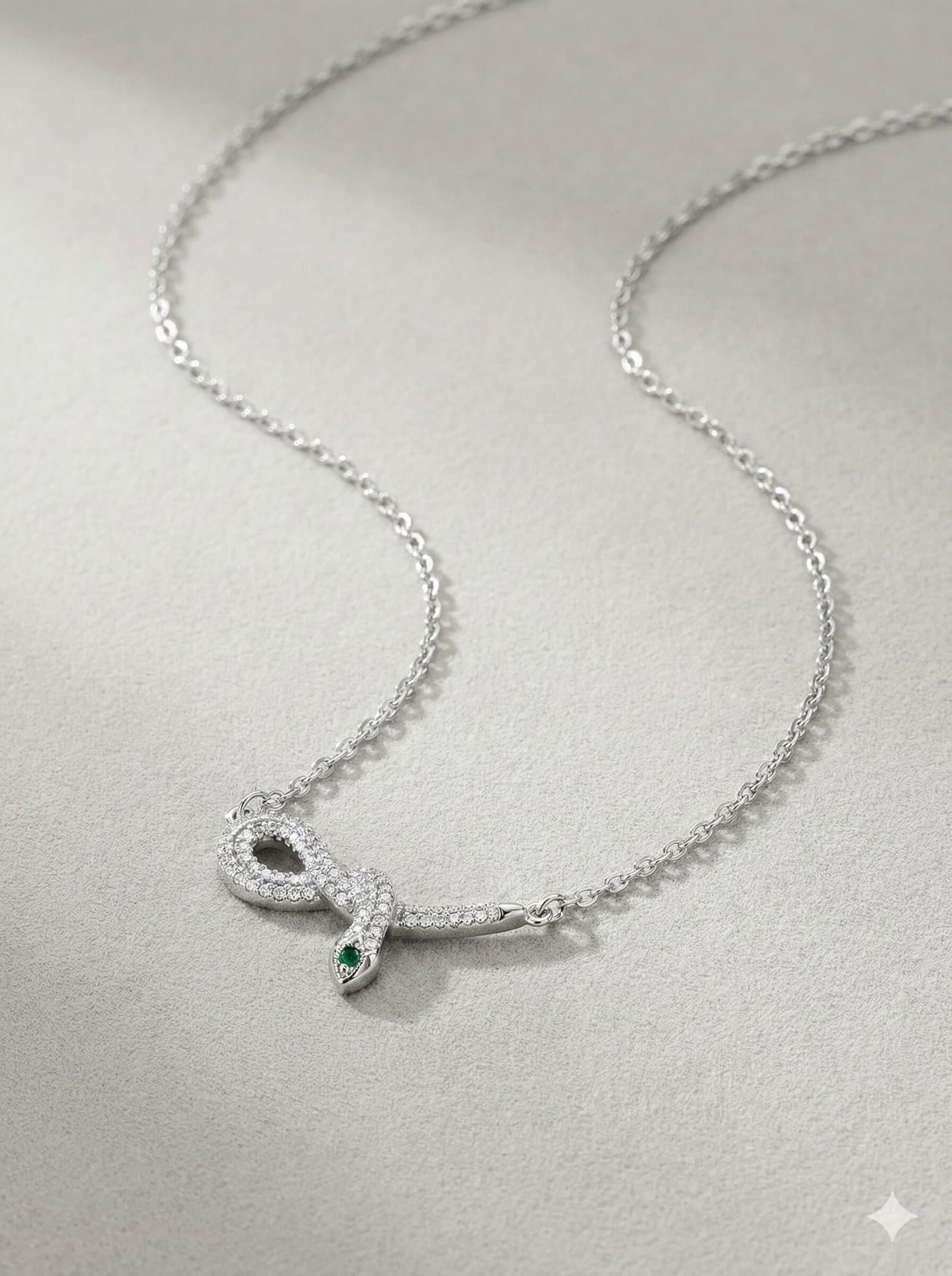 Silver-Tone Coiled Snake Pendant Necklace with Clear Pavé Stones and Green Accents — image 1