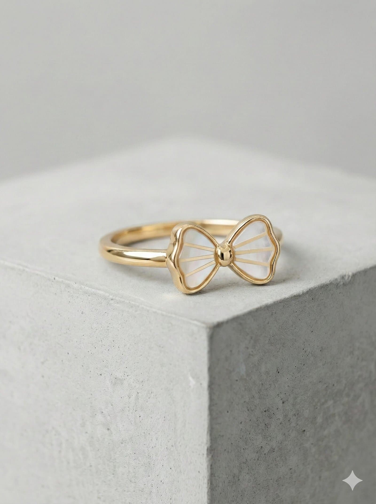 Elegant Gold-Tone Bow Ring with White Pearlescent Inlay and Radial Detailing — image 4