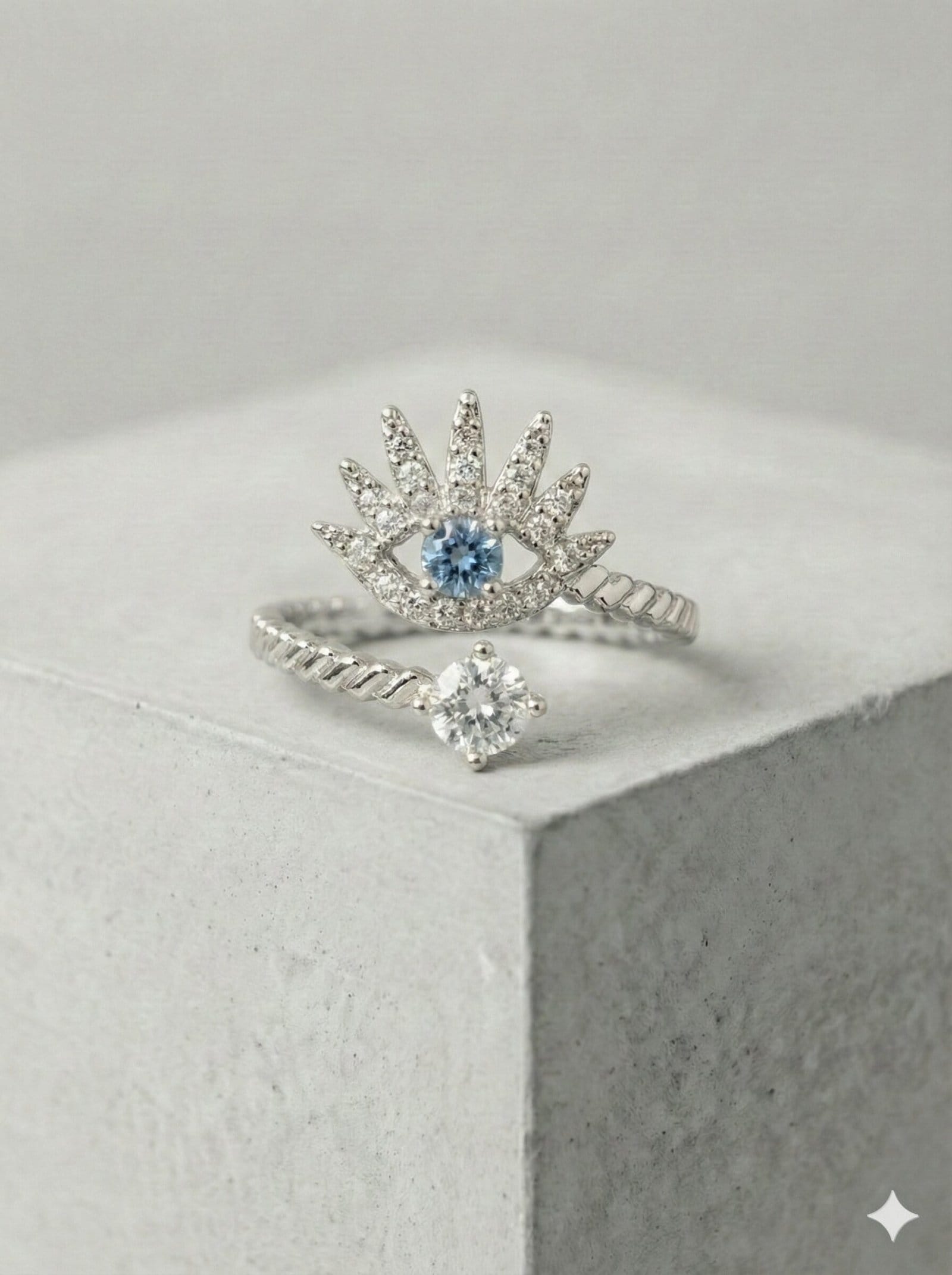 Silver-Tone Twisted Open Ring with Pave Eye Motif and Blue Stone Center